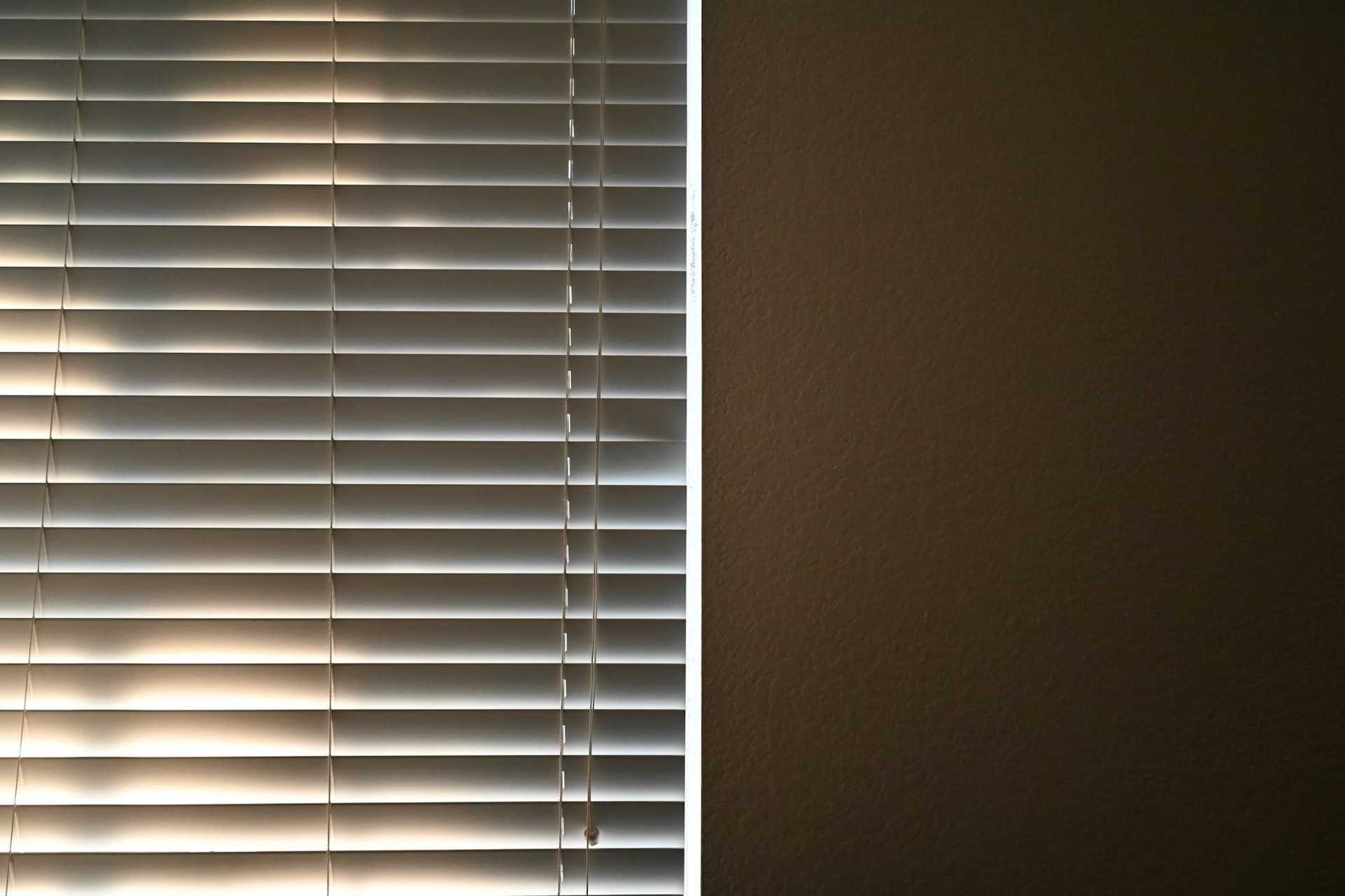 Roman blind fitted to a window in a cosy room